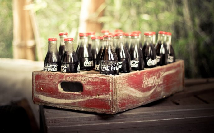 An old box full of juice coca cola