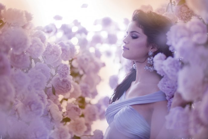 Selena Gomez in a garden full of pink roses