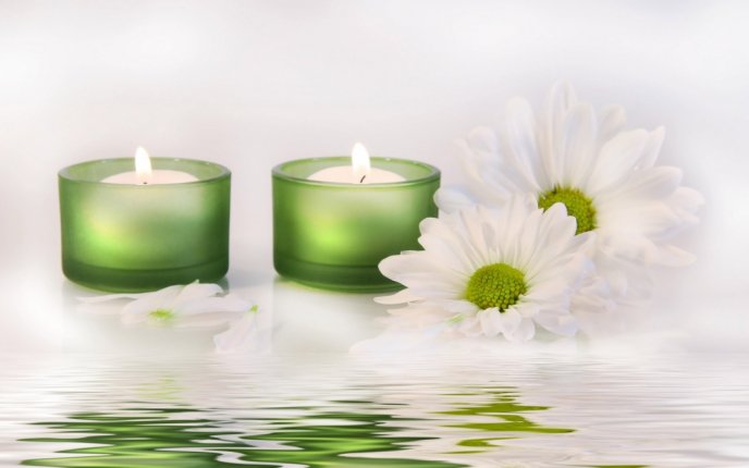 Candles and white spring flowers - relaxing time