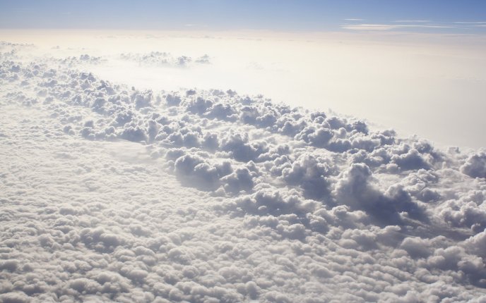 View of  a fluffy carpet of clouds