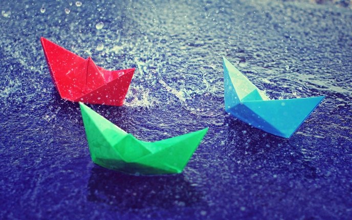 Colored paper boats on the road - Rainy day