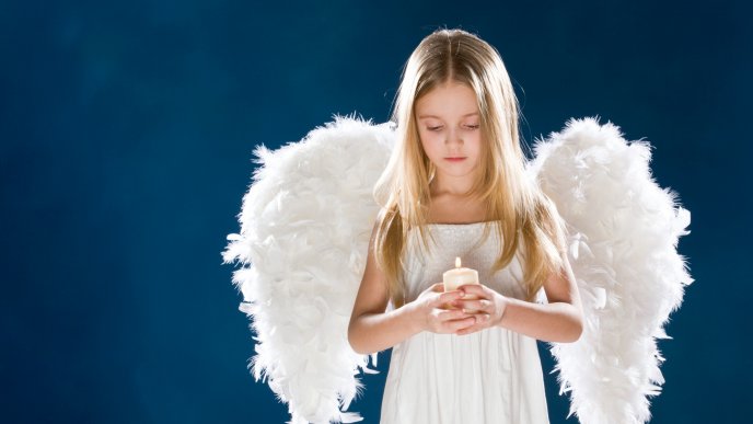 White girl with wings and a candle in hands - Angel girl
