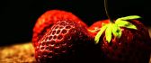 Bulb light over the strawberries - Delicious fruits