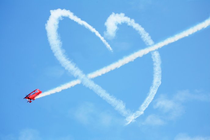 Cupid plane - heart on the sky