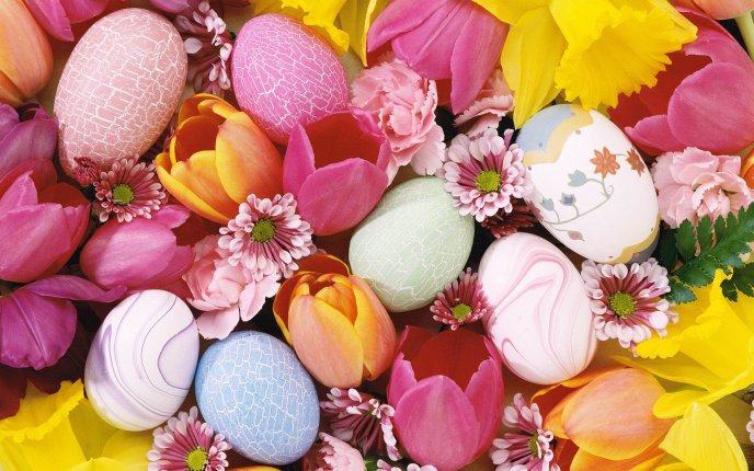A bed of flowers and colored eggs