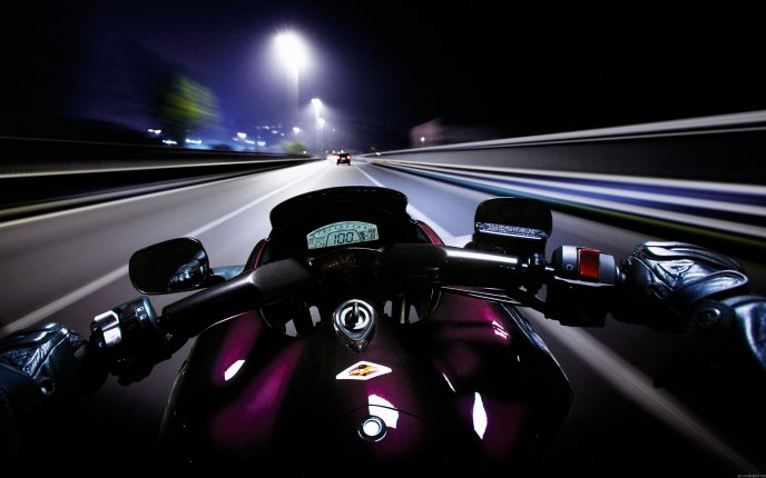 Speed race on a motorcycle in the night