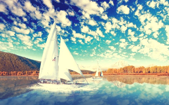 Fantastic blue sky and fluffy clouds - boat on a lake