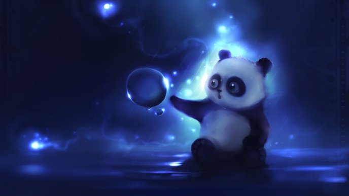 Funny little panda bear playing with a bubble of water