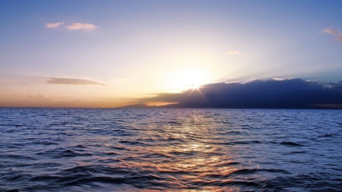 Good morning - sunrise over the calm ocean water