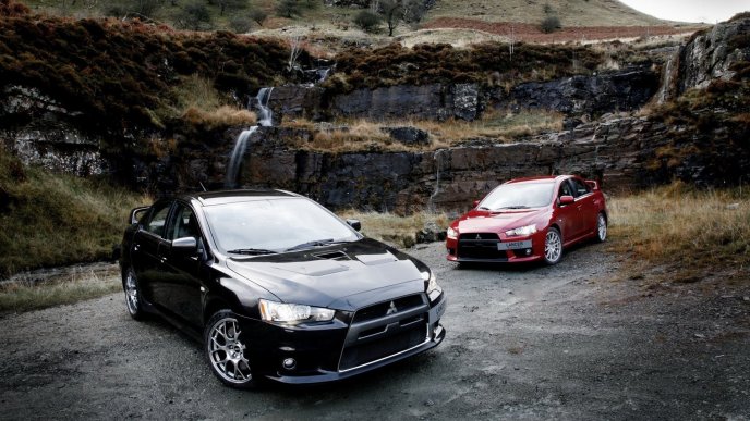 Black and red Mitsubishi Lancer Evolution in mountains