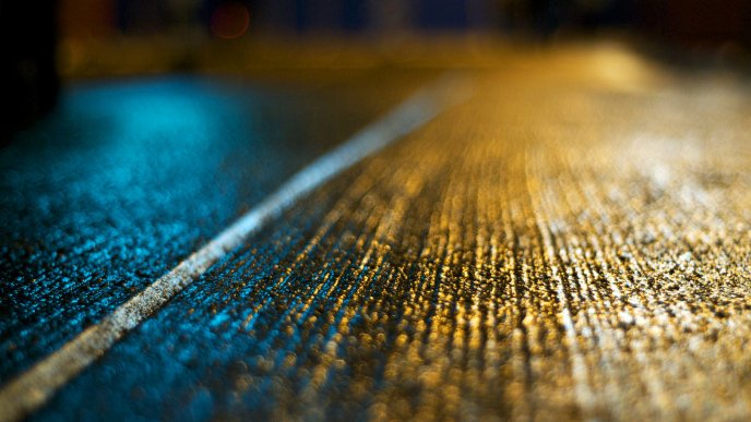 Beautiful texture on the road in the blue and yellow light