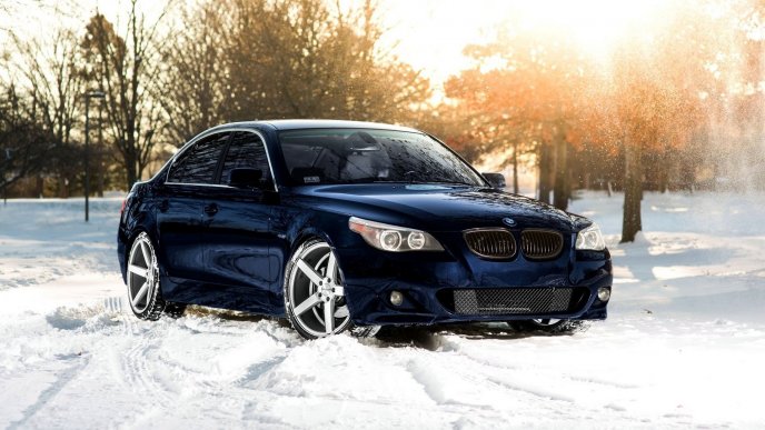 Blue BMW in the white snow - HD Winter wallpaper