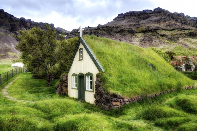 Church with green grass roof -Mountain view wonderful nature