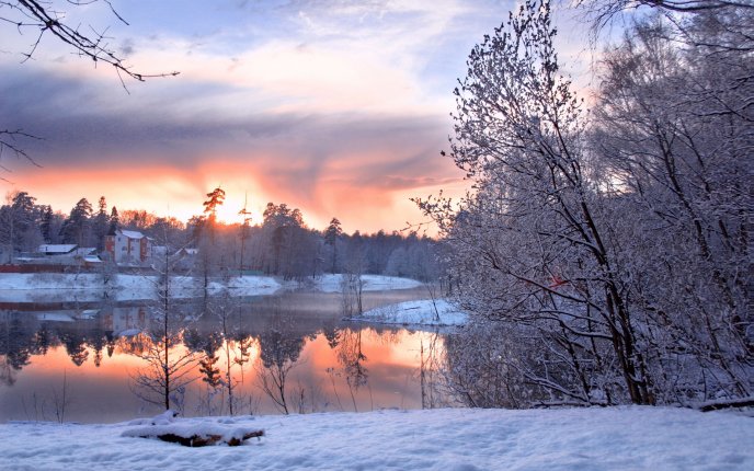Wonderful red sunset mirror over white snow-Winter season