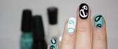 Painted nails black white and turquoise