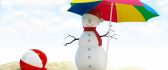 A snowman under an umbrella on beach - Funny wallpaper