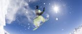 Fantastic snowboarding jump - Sunny winter day