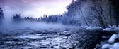 Fog over the cold mountain river in winter season