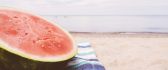 Half Watermelon on the beach - summer time
